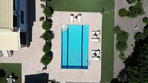 an overhead view of a swimming pool in a yard at Villa Hestia - Seaview Serenity Villa with Private Pool by Villa Mana Gers in Kypseli
