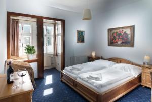 Łóżko lub łóżka w pokoju w obiekcie Depandance Villa Hubertus
