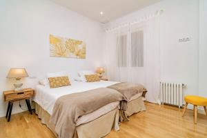 Кровать или кровати в номере Juan Bravo Suites