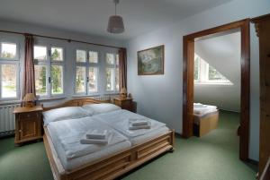 Łóżko lub łóżka w pokoju w obiekcie Depandance Villa Hubertus