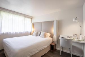 Postel nebo postele na pokoji v ubytování Campanile Reims Ouest - Tinqueux