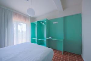 Terra Aurea Aparthotel客房内的一张或多张床位