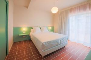 Terra Aurea Aparthotel客房内的一张或多张床位
