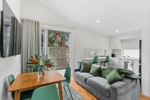 a living room with a couch and a table at WILL56 - Gumtree Studio in Perth