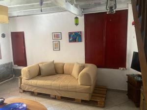 a living room with a couch in a room at Eva's house in Mythimna