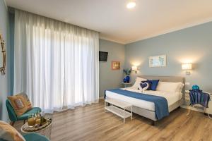 Posteľ alebo postele v izbe v ubytovaní B&B La Cornice