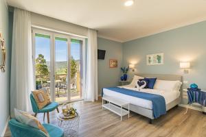 Posteľ alebo postele v izbe v ubytovaní B&B La Cornice