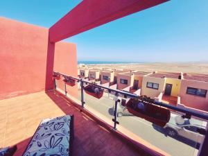 a view from the balcony of a building in the desert at Casa Bella Vista - pool - WiFi in Caleta De Fuste