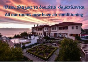 a picture of a house with the words new ahmad use to subaru k at Lagou Raxi Country Hotel in Lafkos