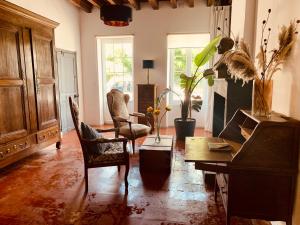 a living room with a couch and a table at 47 Les Chimères in Lussant
