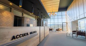 a lobby of an acu lexus office with tables and chairs at Mildiss Hotel - BW Signature Collection in Besse-et-Saint-Anastaise