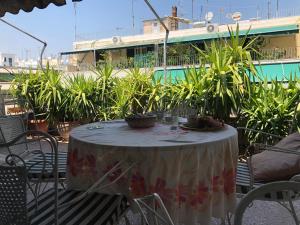 a table with a table cloth on a patio at Spacious Double room in the Center of Athens in Athens