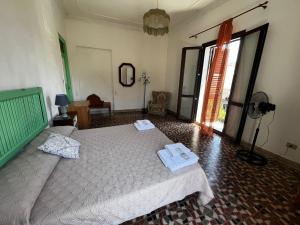 a bedroom with a bed with two towels on it at Mille Lire in Palermo