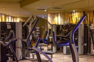 a gym with rows of chairs in front of a mirror at Hotel SB Plaza Europa in Hospitalet de Llobregat