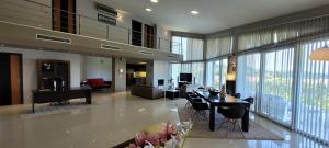 a large living room with a table and chairs at Mythos luxury apartments in Corfu Town