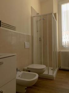 a bathroom with a shower and a toilet and a sink at Appartamento centro storico Nuovo e Ristrutturato in Pesaro