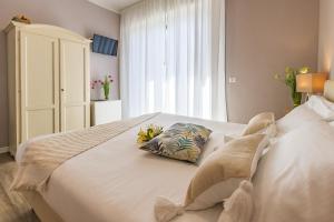 Posteľ alebo postele v izbe v ubytovaní B&B La Cornice