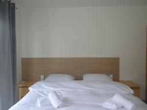 Posteľ alebo postele v izbe v ubytovaní 4family *RESORT*SPA*