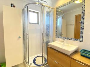 a bathroom with a shower and a sink at Vilamoura Central 7 With Pool by Homing in Vilamoura +15 photos
