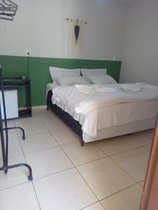 Cama o camas de una habitación en Pousada Marinho Society