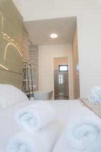 Voodi või voodid majutusasutuse RUDINI' CHARMING ROOM toas