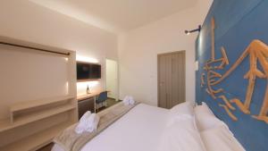 Voodi või voodid majutusasutuse RUDINI' CHARMING ROOM toas