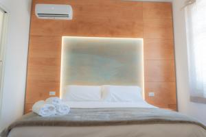 Voodi või voodid majutusasutuse RUDINI' CHARMING ROOM toas