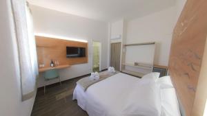 Voodi või voodid majutusasutuse RUDINI' CHARMING ROOM toas