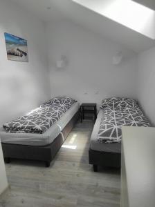 Ένα ή περισσότερα κρεβάτια σε δωμάτιο στο Domki na Polnej