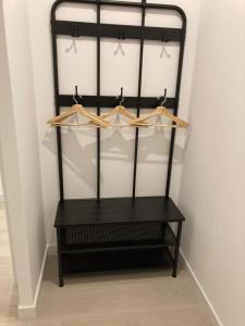 a black chair in a room with hangers at Matadero Apartments 3 in Madrid