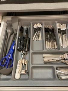 a tray filled with utensils in a drawer at Matadero Apartments 3 in Madrid