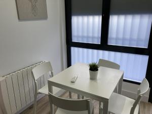 A seating area at Plaza Castilla Apartments