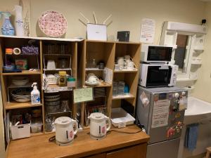 Kuchyň nebo kuchyňský kout v ubytování Tsukiji Hostel Wakayama 1