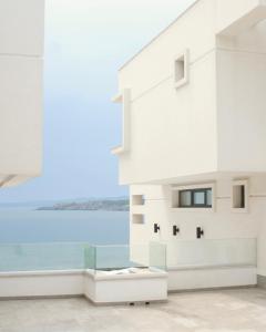 a rendering of a building with a view of the water at Olive Villas Beach Hotel in Sozopol