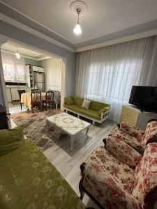 a hotel room with two beds and a living room at Xudisa Manzaram in Pazar