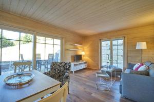 a living room with a couch and a table at Alb Appartements in Albstadt