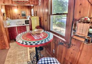 a kitchen with a small table in a room at Suite Memories #5/ Oak Crest in Eureka Springs