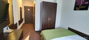 Łóżko lub łóżka w pokoju w obiekcie Hotel Pod Szrenicą