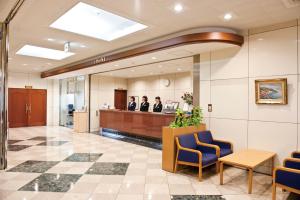 a lobby of a hospital with people in a waiting room at Hotel Unisite Sendai in Sendai