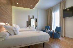 TV a/nebo společenská místnost v ubytování Hotel Monte Puertatierra