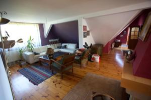 a living room with a couch and a table at Willa Ranczo in Kończyce Wielkie