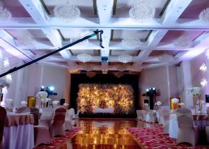 a banquet hall with white chairs and a fireplace at Kuwait Grand Hotel in Kuwait +142 photos