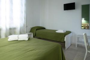 Ένα ή περισσότερα κρεβάτια σε δωμάτιο στο Amma B&B