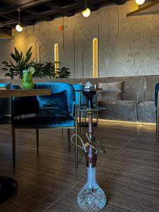 a dining room with a table and blue chairs at Grand Hotel in Kuwait