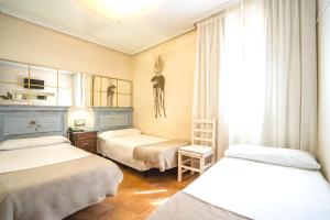 Postel nebo postele na pokoji v ubytování YIT Puerta Bisagra