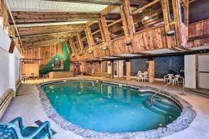 a pool in a large room with wooden walls and ceilings at Wilmington Vacation Rental Near Hiking and Skiing! in Wilmington