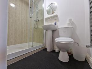 a bathroom with a toilet and a shower at Nice Living Serviced Accommodations 8 (Entire 2 Ensuite Bedroom House) in Coventry