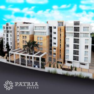 a model of a city with buildings and palm trees at Patria Suites in Rajkot