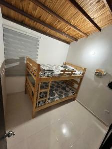 a room with a bunk bed with a toy car on it at Apartamento de descaso por san Gil in San Gil
