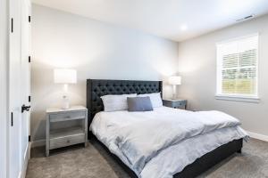 a bedroom with a large bed and a window at Modern Mountain Retreat in Keetley